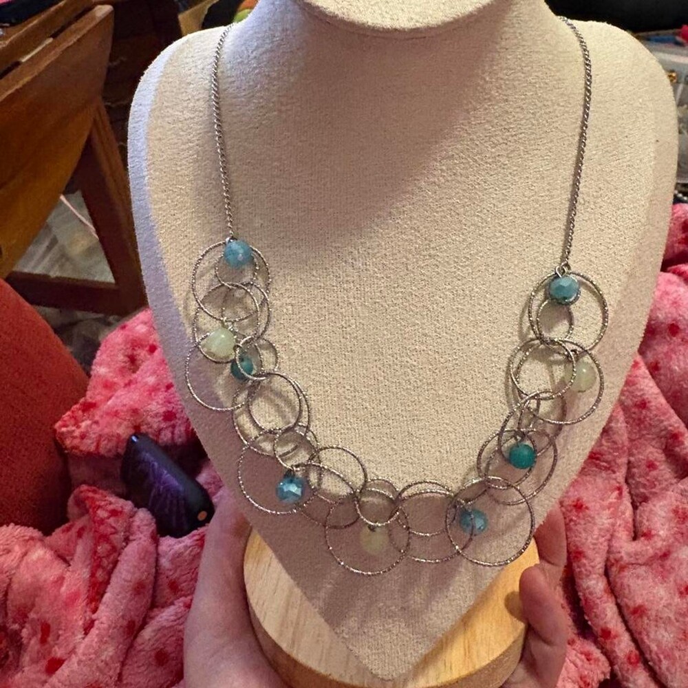 Blue and silver necklace with circular wire links and blue and green beads #bead